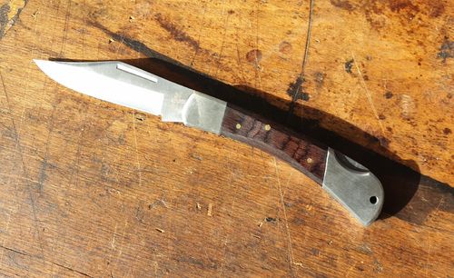 Lock knife with 420 stainless steel blade  Handle made of pakka wood Solingen